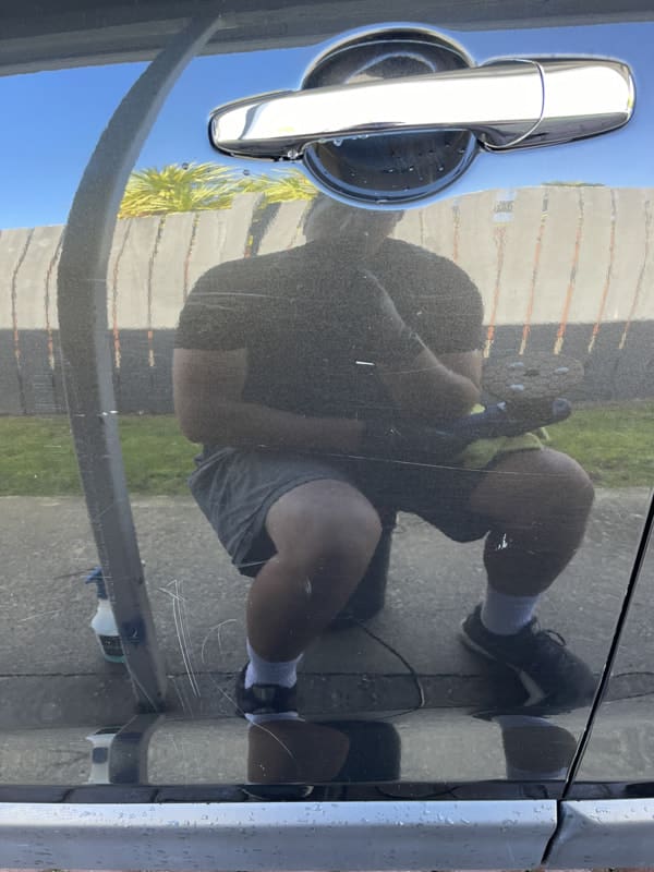 Scratch removal from vehicle side before detailing